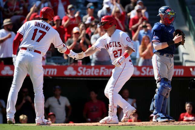 POWERED COUPLE: Angels center fielder Mike Trout (27) and designated hitter Shohei Ohtani (17) after hitting a home run during the fourth inning against the Texas Rangers at Angel Stadium.
