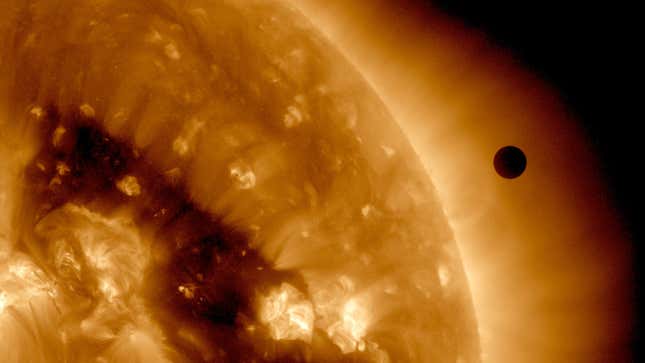 The transit of Venus (right) across the sun’s face in 2012, as seen in false color by the SDO satellite.