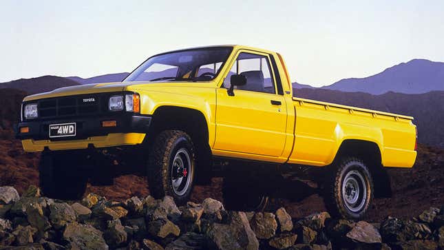 A yellow Toyota Hilux pickup truck 