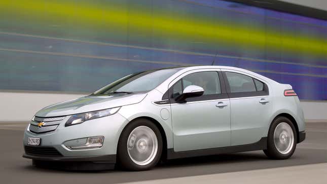 A photo of a Chevrolet Volt PHEV driving on a road. 