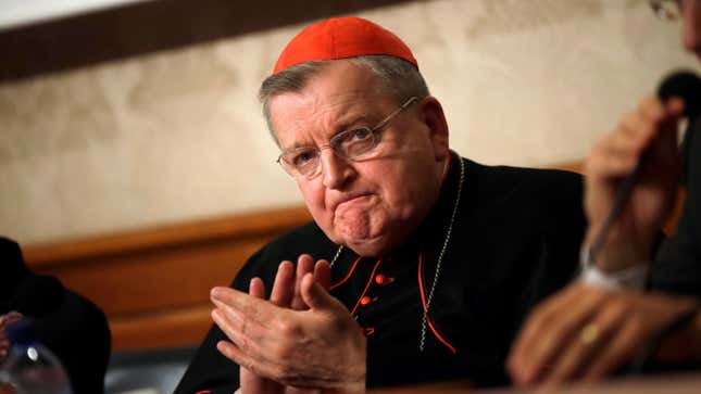 In this Sept. 6, 2018 file photo, Cardinal Raymond Burke  applauds during a press conference at the Italian Senate in Rome.