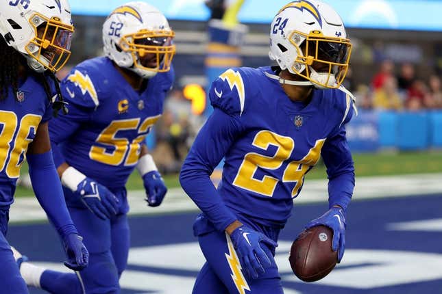 Dec 18, 2022; Inglewood, California, USA; Los Angeles Chargers safety Nasir Adderley (24) reacts after intercepting a pass during the third quarter against the Tennessee Titans at SoFi Stadium.