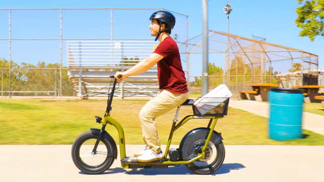 The Razor EcoSmart Cargo with a single passenger and cargo basket on the back.