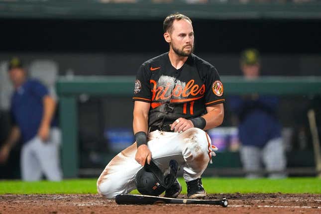 May 20, 2022; Baltimore, Maryland, USA; Baltimore Orioles second baseman Chris Owings (11) reacts to being tagged out a home plate during the fifth inning against the Tampa Bay Rays at Oriole Park at Camden Yards.