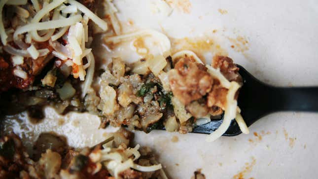 closeup of a forkful of cauliflower rice in chipotle burrito bowl