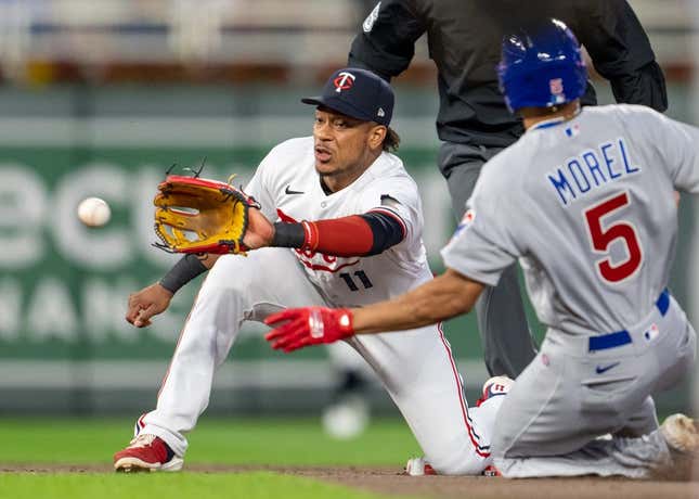May 12, 2023; Minneapolis, Minnesota, USA; Minnesota Twins second baseman Jorge Polanco (11) gets Chicago Cubs center fielder Christopher Morel (5) out while trying to steal second base in the fifth inning at Target Field.