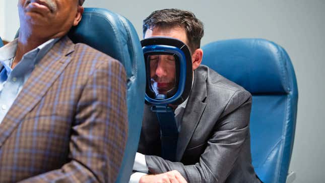 A person sleeping on a plane seat using the TruRest support.