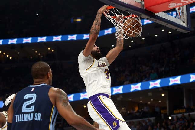 Apr 16, 2023; Memphis, Tennessee, USA; Los Angeles Lakers forward Anthony Davis (3) dunks during the first half during Game 1 of the 2023 NBA playoffs against the Memphis Grizzlies at FedExForum.