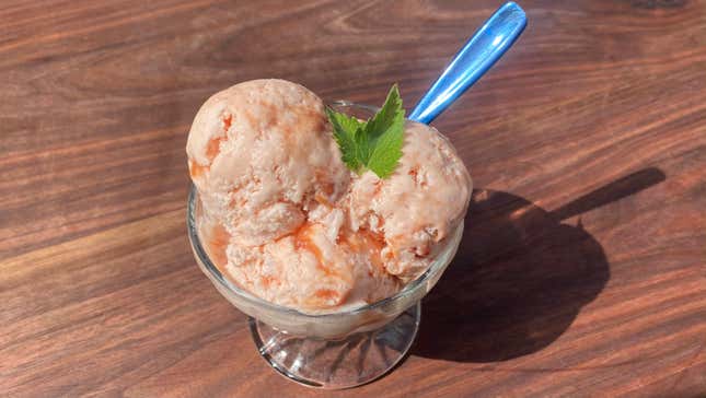 Glass dish of Guava Cream Cheese Sherbet on wooden background