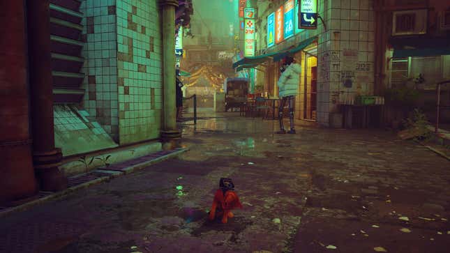 A cat bats a puddle in Stray.
