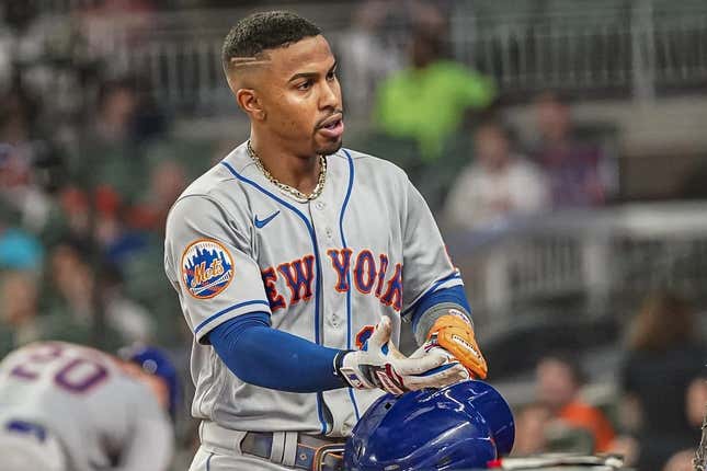 Aug 21, 2023; Cumberland, Georgia, USA; New York Mets shortstop Francisco Lindor (12) reacts at the dugout steps after hitting a three run home run against the Atlanta Braves during the sixth inning at Truist Park.