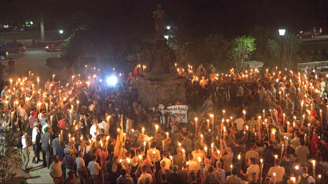 White nationalists chanting the Nazi slogan “Blood and Soil” surround students rallying on the UVA campus.