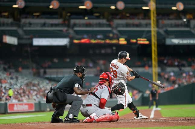 Sep 11, 2023; Baltimore, Maryland, USA;  Baltimore Orioles third baseman Ramon Urias (29) hits a second inning rbi single against the St. Louis Cardinals at Oriole Park at Camden Yards.