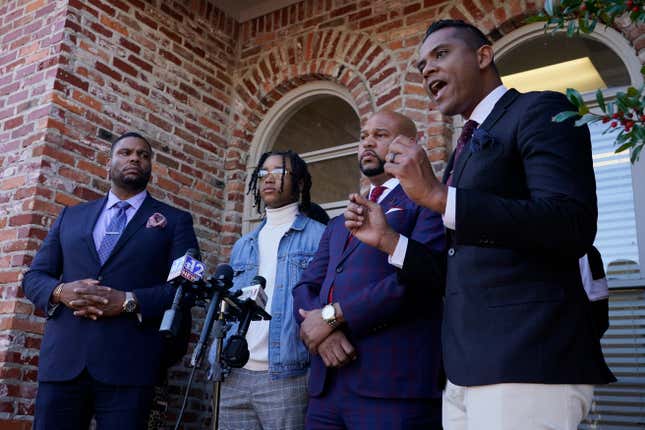 FedEx driver D’Monterrio Gibson, second from left, stands with his legal team of attorneys, Rodney S. Diggs, left, Carlos Moore, second from right, as they listen to a James A. Bryant II, also a lawyer and member of their legal team, speak during a news conference in Ridgeland, Miss., Thursday, Feb. 10, 2022. 