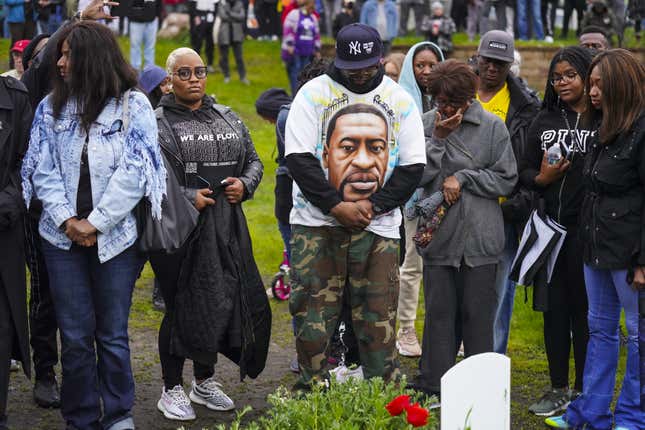 MINNEAPOLIS, MINNESOTA - MAY 25: Community members gather for a candlelight vigil at George Floyd Square.