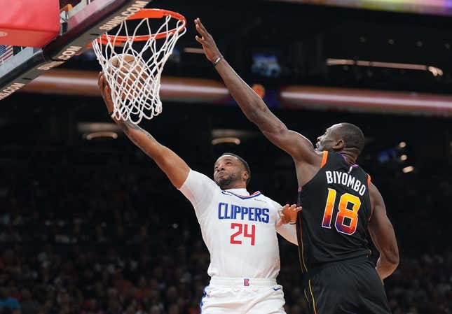 Apr 16, 2023; Phoenix, Arizona, USA; LA Clippers guard Norman Powell (24) puts up a layup against Phoenix Suns center Bismack Biyombo (18) during the first half of game one of the 2023 NBA playoffs at Footprint Center.