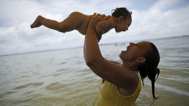 Rosana Vieira Alves holds her 4-month-old daughter Luana Vieira, who was born with microcephaly.