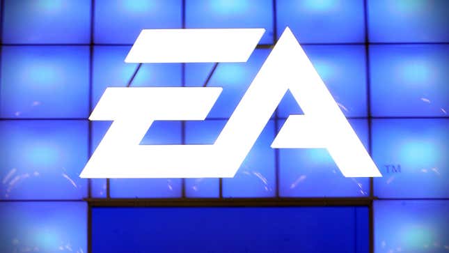A massive EA logo appears in front of a wall of blue displays at a trade show-style event.