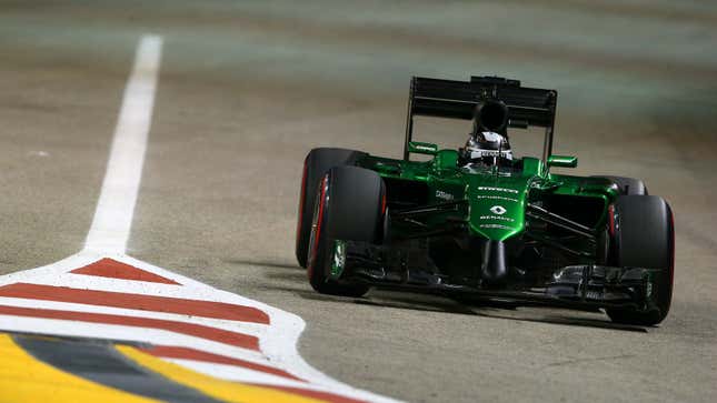 A photo of the 2014 Caterham F1 car racing in Bahrain. 