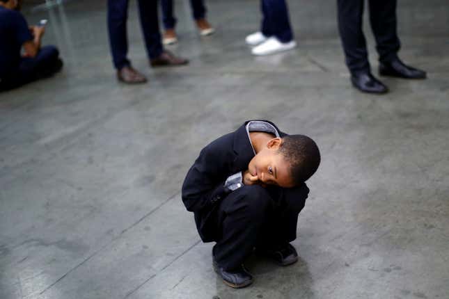 Boy rests in a squat