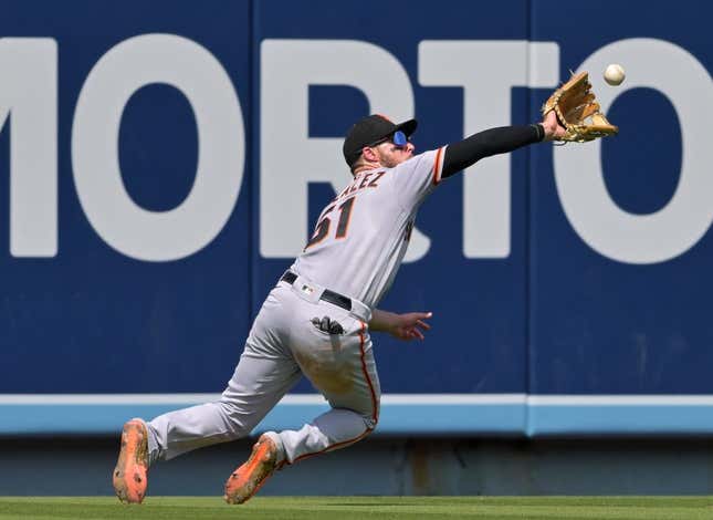 Sep 7, 2022; Los Angeles, California, USA;  San Francisco Giants right fielder Luis Gonzalez (51) makes a catch off a ball hit by Los Angeles Dodgers third baseman Miguel Vargas (not pictured) in the fourth inning at Dodger Stadium.