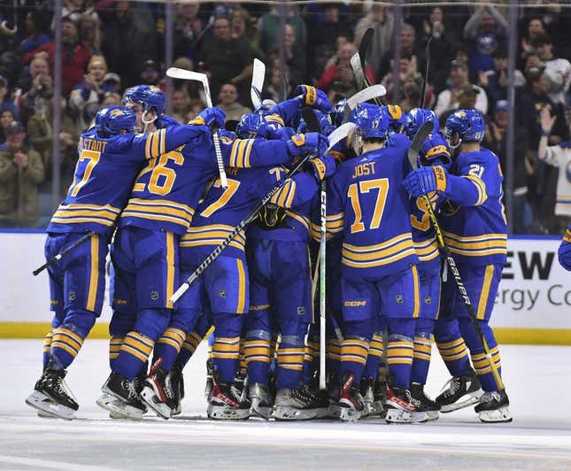 Mar 31, 2023; Buffalo, New York, USA; The Buffalo Sabres celebrate a winning goal in the overtime period against the New York Rangers at KeyBank Center.