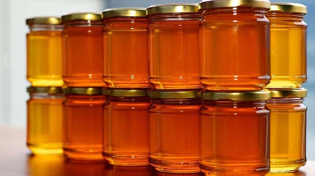 Jars of honey stacked on top of each other