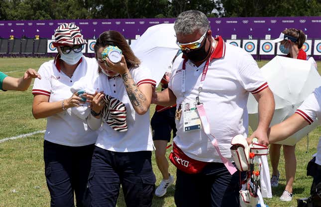 Svetlana Gomboeva of Team ROC is treated for heat exhaustion in the Women’s Individual Ranking Round during the Tokyo 2020 Olympic Games at Yumenoshima Park Archery Field on July 23, 2021 in Tokyo, Japan. 