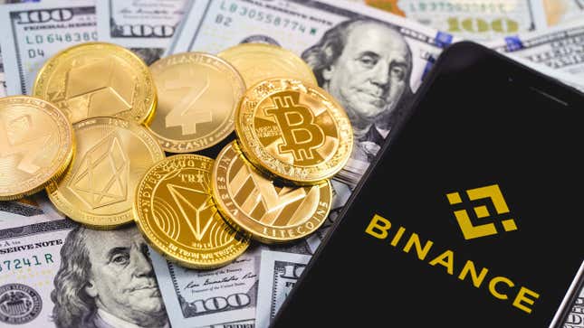 Stock photo of Binance logo on phone against US currency