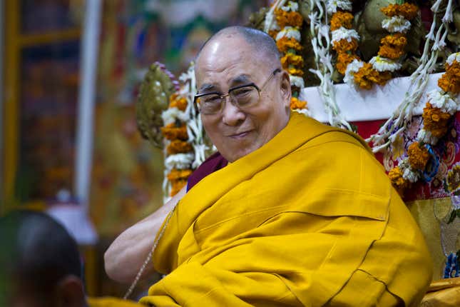 The Dalai Lama smiles as he sits on his chair at the Tsuglakhang temple in Dharmsala, India, Feb. 27, 2019.