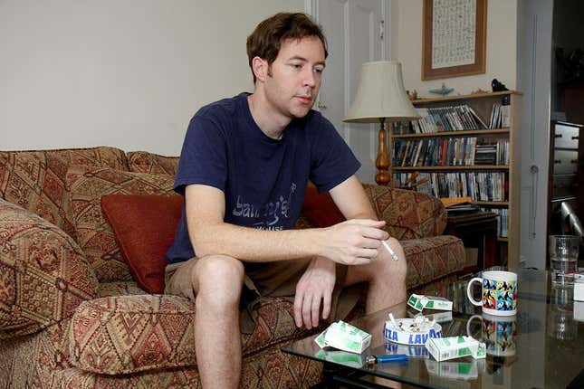 An environmentally conscious smoker does his part to make a difference about once every 20 minutes or so.