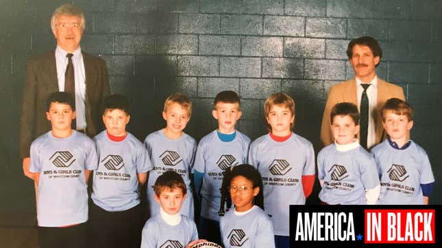 Angela Tucker (bottom right) posing with her basketball team at the Boys and Girls Club in 1993. She is the only girl and only black person on the team.