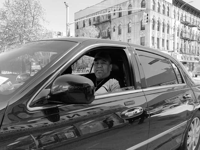 Mago, of Bushwick Car Service, in his 2011 Lincoln Town Car.