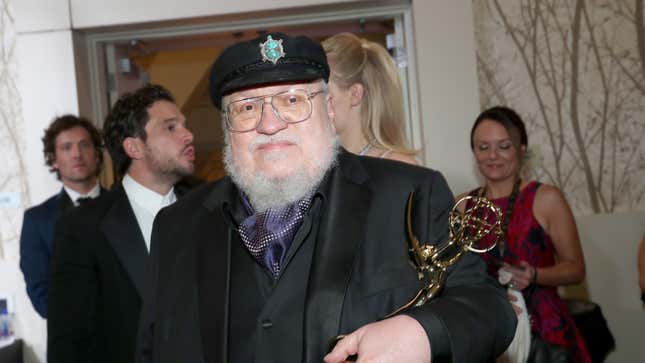 George R.R. Martin and his small golden friend