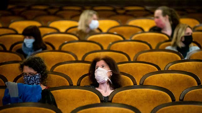 Customers wearing protective masks sit apart in observance of social distancing measures inside a movie theater as the Czech government lifted more restrictions allowing cinemas to re-open on May 11, 2020, in Prague, Czech Republic.