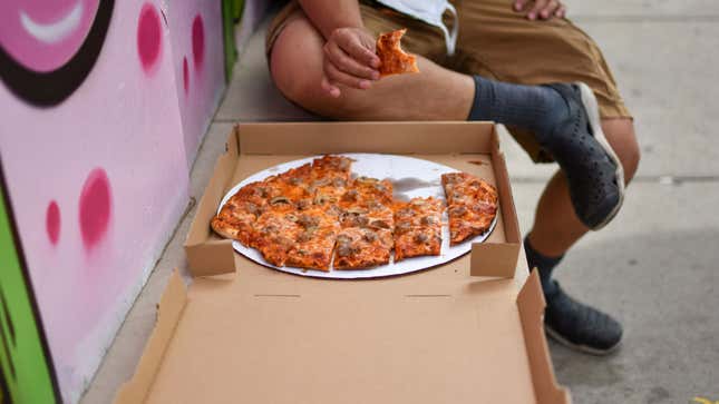 Derrick Tung, owner of Paulie Gee’s Logan Square, tastes one of Pizzadad’s creations