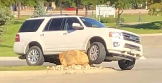Image for article titled Evil Boulder Menace Somehow Manages To Take Out A Fistful Of SUVs
