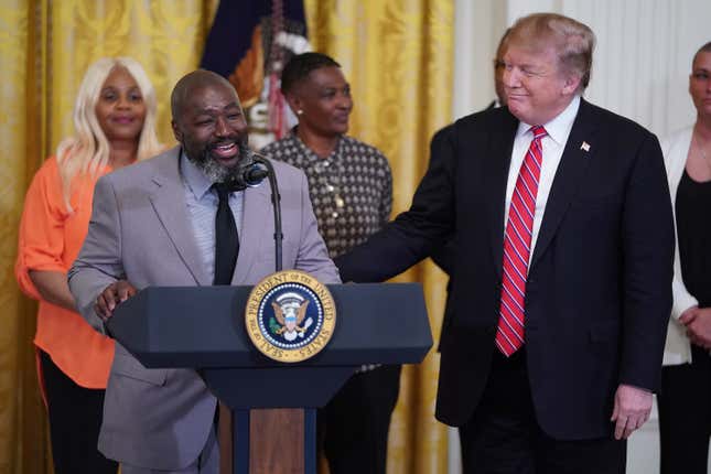 Matthew Charles, who was released from from federal prison after serving 20 years for selling crack cocaine, joins U.S. President Donald Trump for a First Step Act celebration in the East Room of the White House .