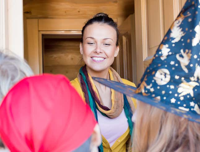 Image for article titled Woman Passing Out Candy Unsure Whether To Give Some To Teen Mom Too