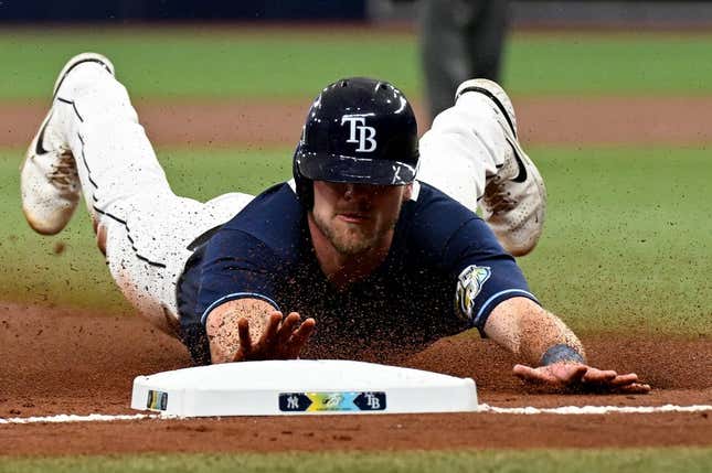 Aug 26, 2023; St. Petersburg, Florida, USA; Tampa Bay Rays center fielder Luke Raley (55) slides into third base against the New York Yankees in the second inning at Tropicana Field.