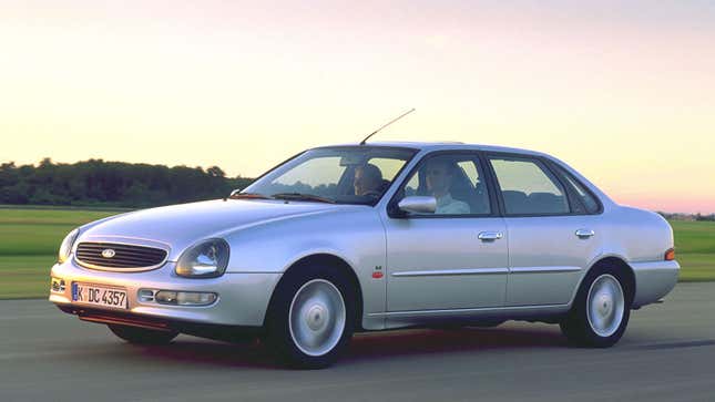 A photo of a silver Ford Scorpio sedan.