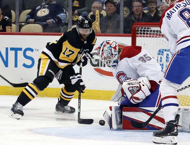 Mar 14, 2023; Pittsburgh, Pennsylvania, USA; Montreal Canadiens goaltender Sam Montembeault (35) makes a save against Pittsburgh Penguins right wing Bryan Rust (17) during the first period at PPG Paints Arena.