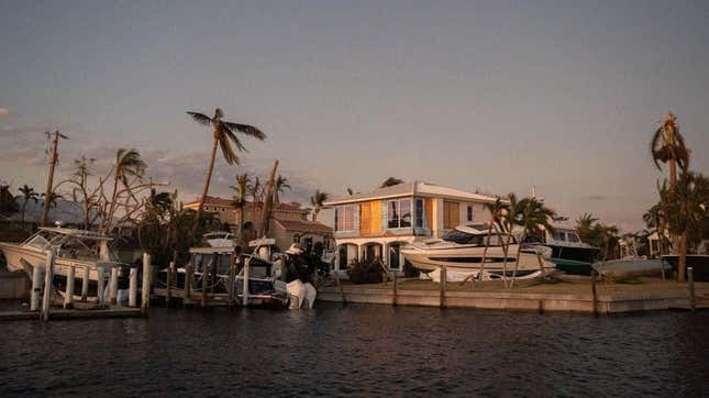 Boats litter a canal residence on October 1, 2022 on Sanibel Island, Florida after Hurricane Ian. 