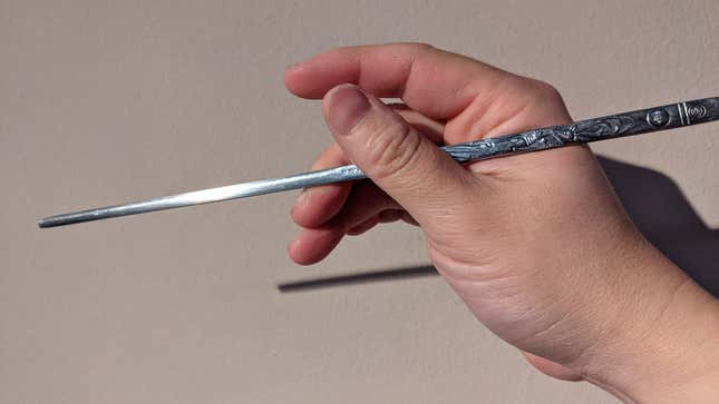 hand holding single chopstick