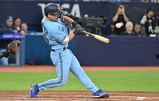 Aug 28, 2023; Toronto, Ontario, CAN;  Toronto Blue Jays third baseman Davis Schneider (36) hits an RBI single against the Washington National in the second inning at Rogers Centre.