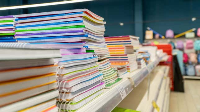 colorful notebooks stacked a shelf in a store