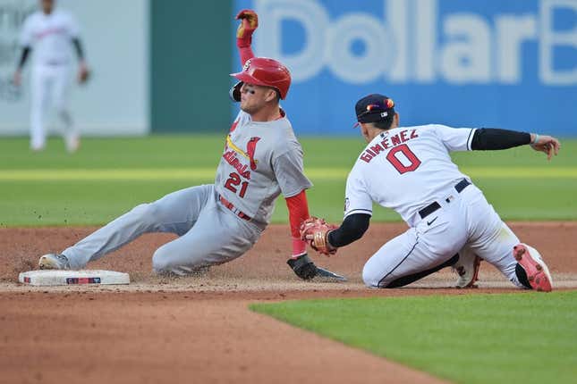 May 26, 2023;  Cleveland, Ohio, USA;  St. Louis Cardinals center fielder Lars Nootbaar (21) is hit by a steal by Cleveland Guardians second baseman Andres Gimenez (0) in the third inning at Progressive Field.