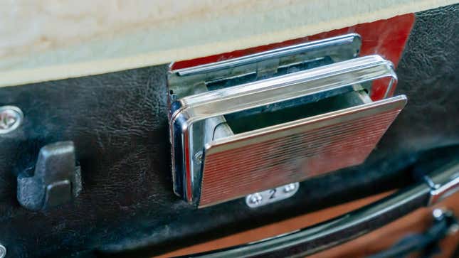 The close-up photo of the Mercedes-Benz O 302's seat back ashtray