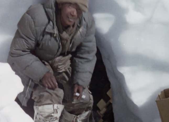 At home in a snow hole. Still from Kangchenjunga 1955.