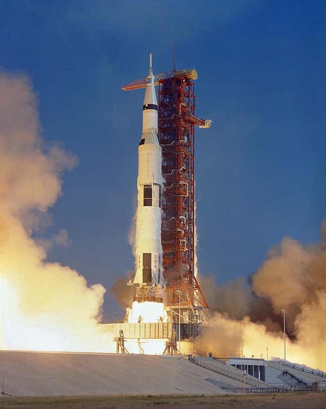 A rocket carrying Apollo 11 and its crew toward the Moon lifts off